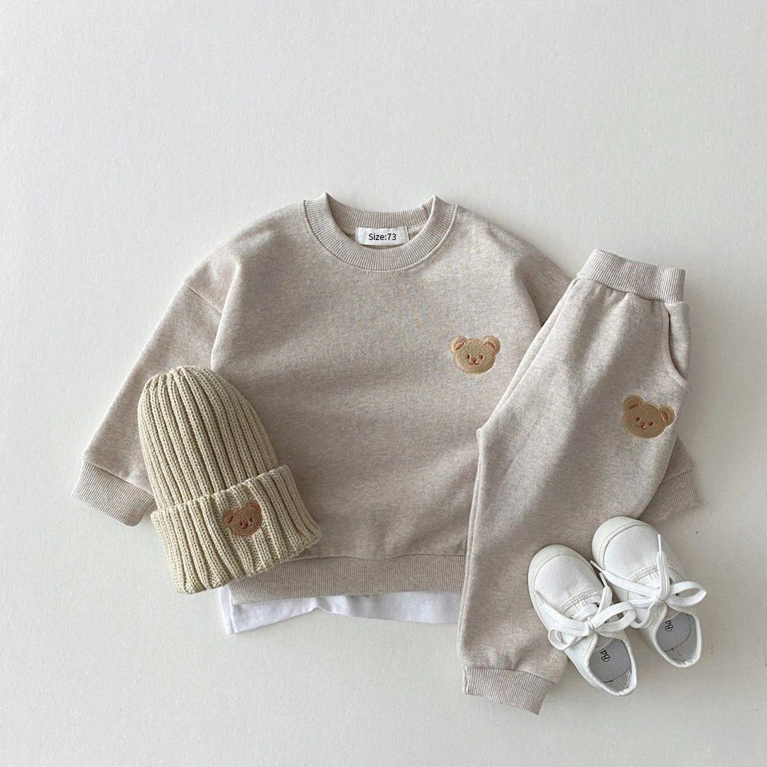 Baby's jogging outfit: sweatshirt, pants, and hat