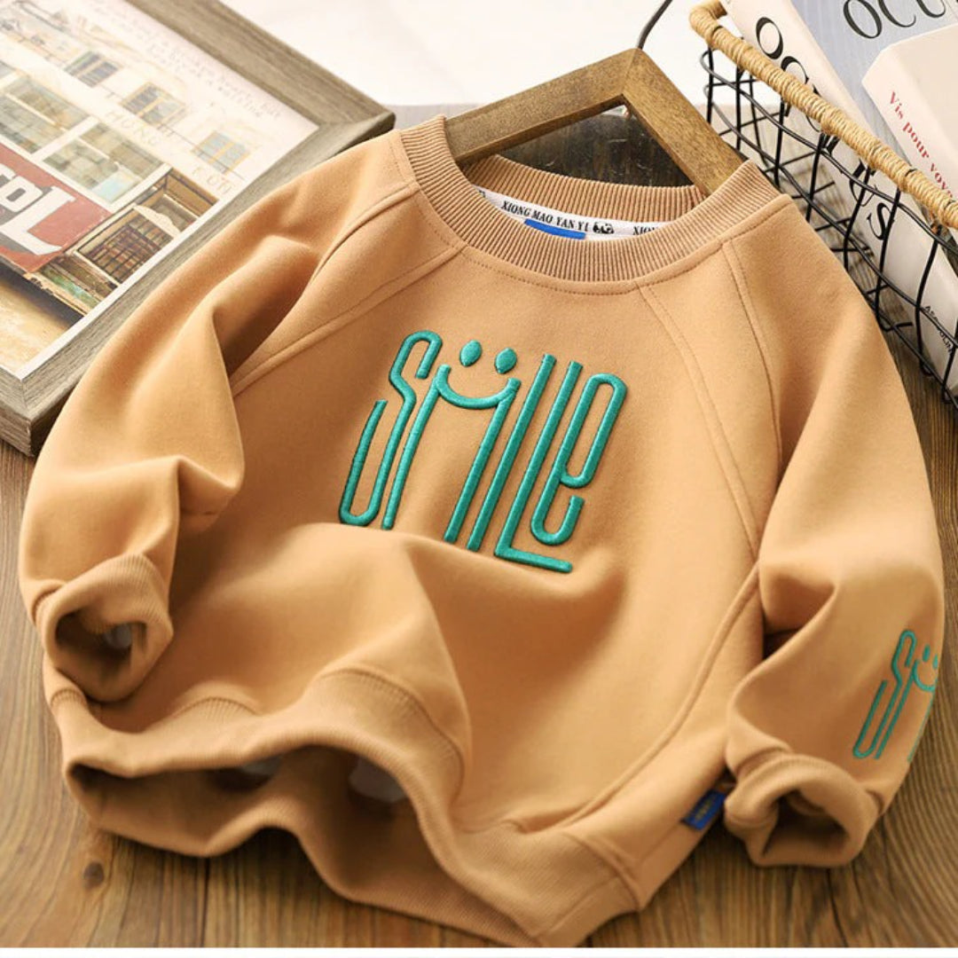 Unisex Kinderpullover mit einem fröhlichen Smile-Design
